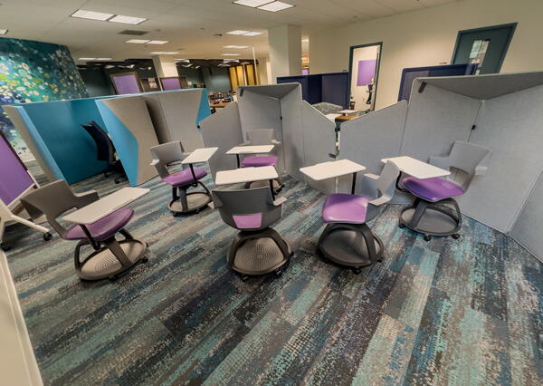Movable chairs with attached individual desks