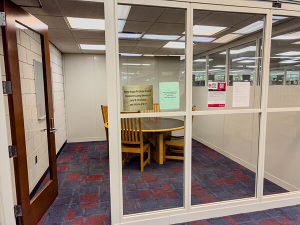Open door and glass wall looking into group study room