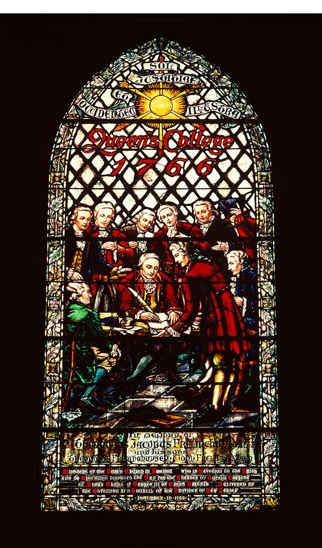 Stained-glass window in Kirkpatrick Chapel depicting William Franklin, Royal Governor of New Jersey, signing the Queen's College charter in 1766.