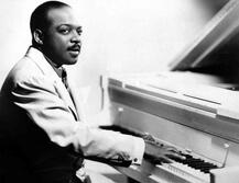 Count Basie at the piano.